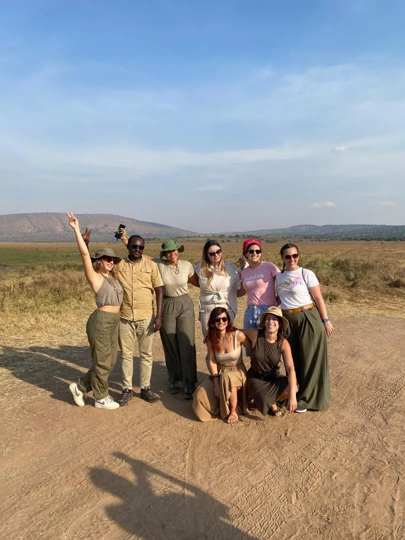 Kelly's group on safari at Akagera National Park — happy travellers, open savanna